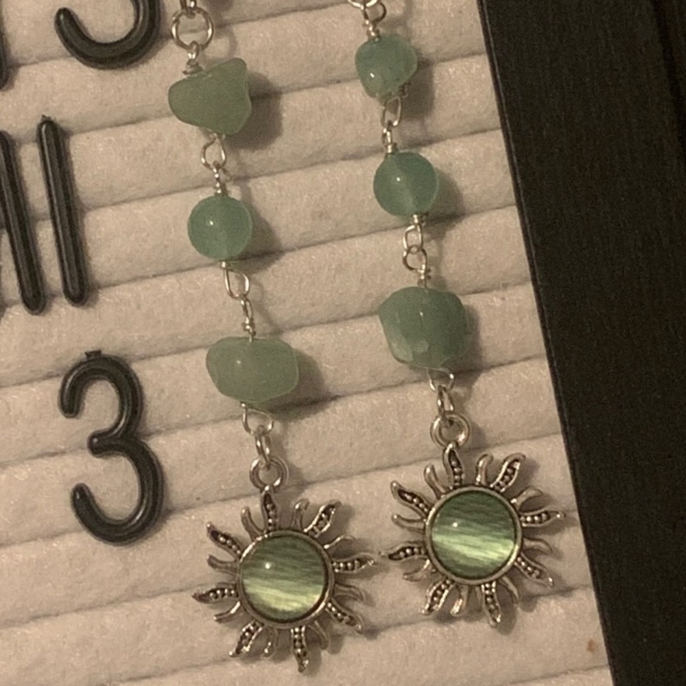 green crystal sun earrings